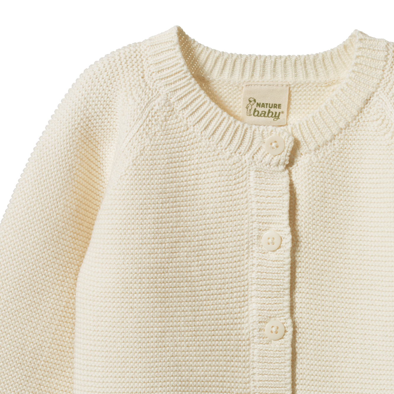 Cream organic cotton Pepi Cardigan with garter stitch knit and corozo nut buttons.
