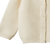 Cream organic cotton Pepi Cardigan with garter stitch knit and corozo nut buttons.